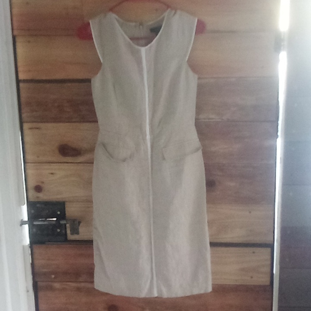 Tan sleeveless dress with white lining comfy.         J. Crew size 2